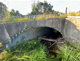 Large pipe under roadway
