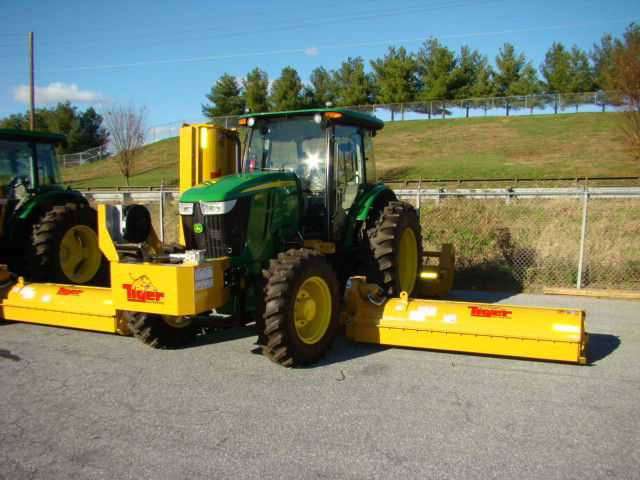 Mower with side pieces for vegetation managament