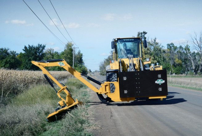 brush cutting on side of roadway.