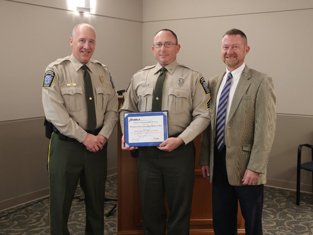 Colonel Jeff Sabo, WCO Michael Blair and Executive Director Tim Schaeffer pictured together honoring WCO Blair's outstanding service with the PFBC