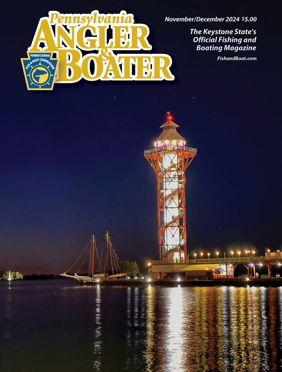 Cover of the November/December 2024 edition of PA Angler & Boater Magazine picturing a lighthouse lit up at night surrounded by sailboats.