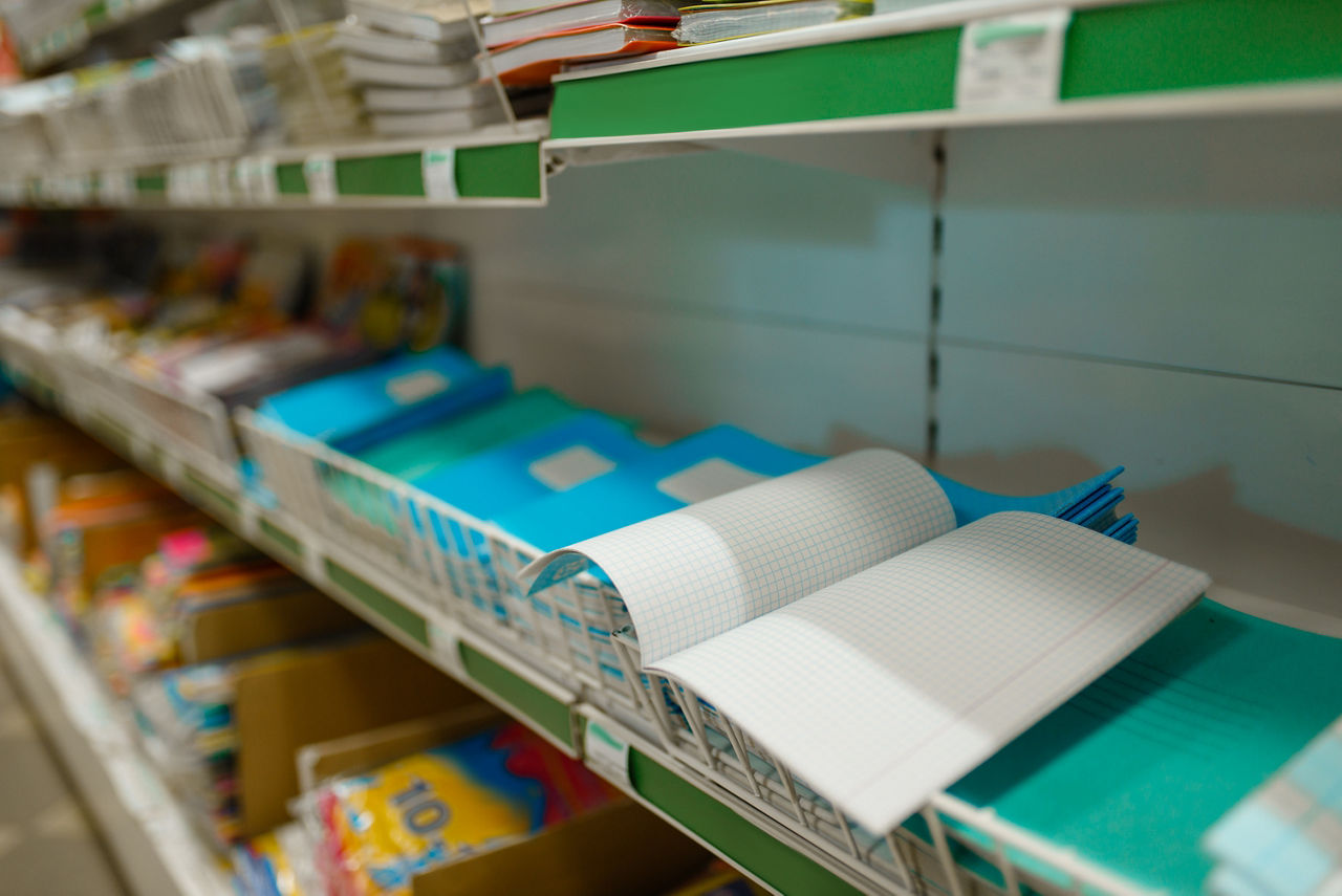 Shelf with notebooks, stationery closet