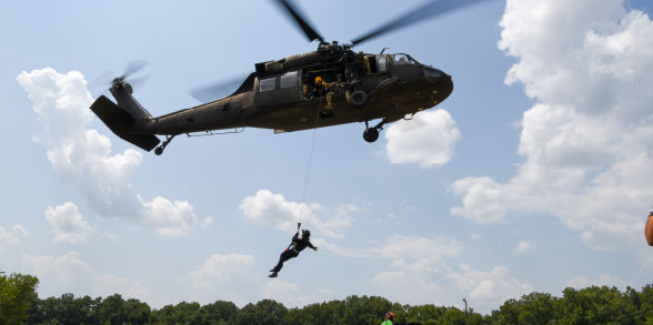 A Pennsylvania Helicopter Aquatic Rescue Team member repels from a helicopter during a training.