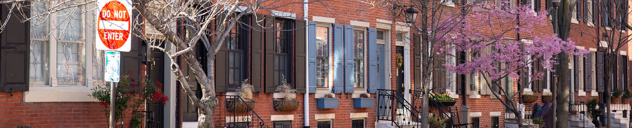 Brick rowhomes along a residential street in Center City, Philadelphia.