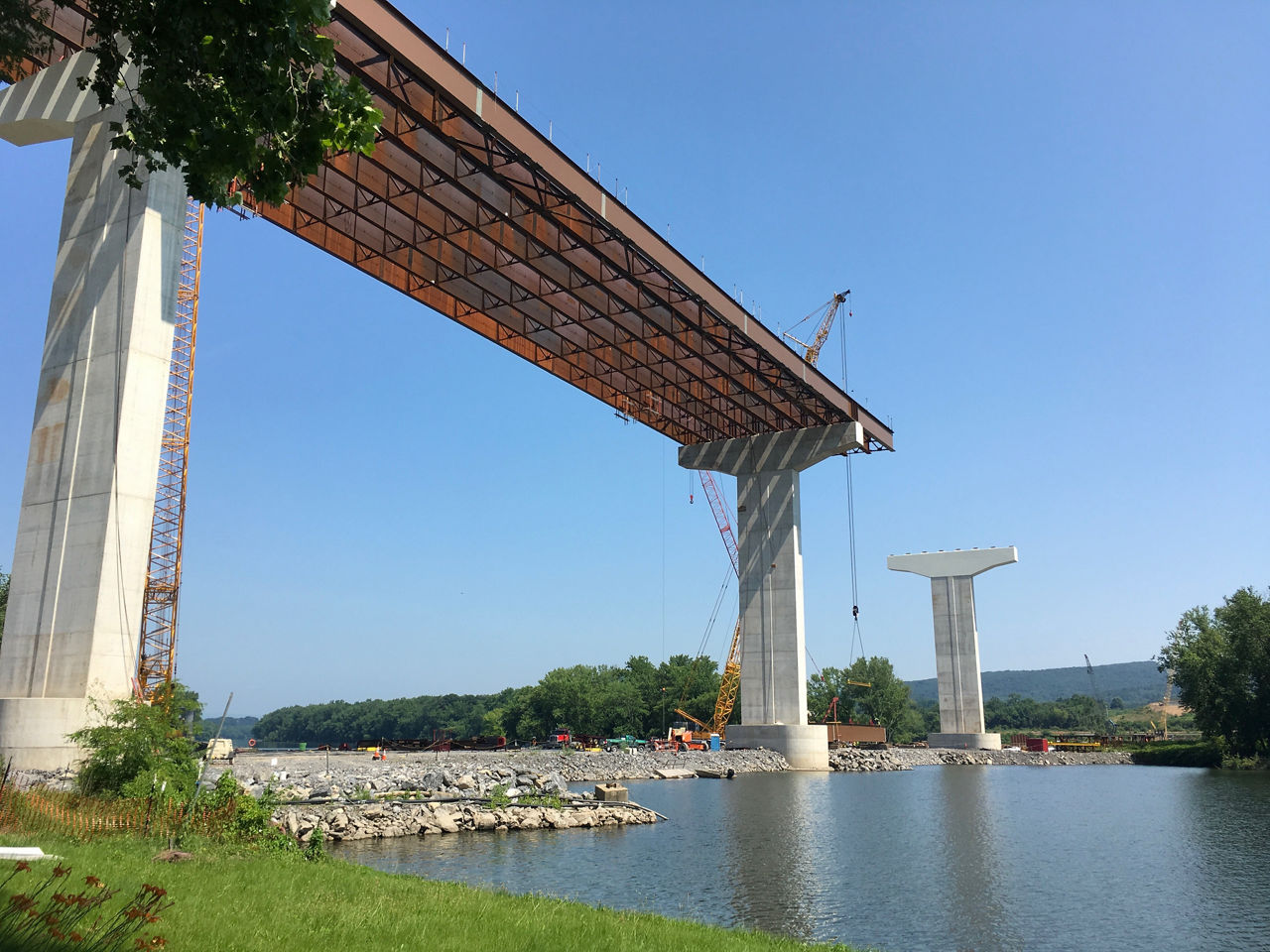 A bridge being constructed over a waterway.