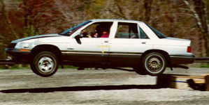 White car jumping ramp