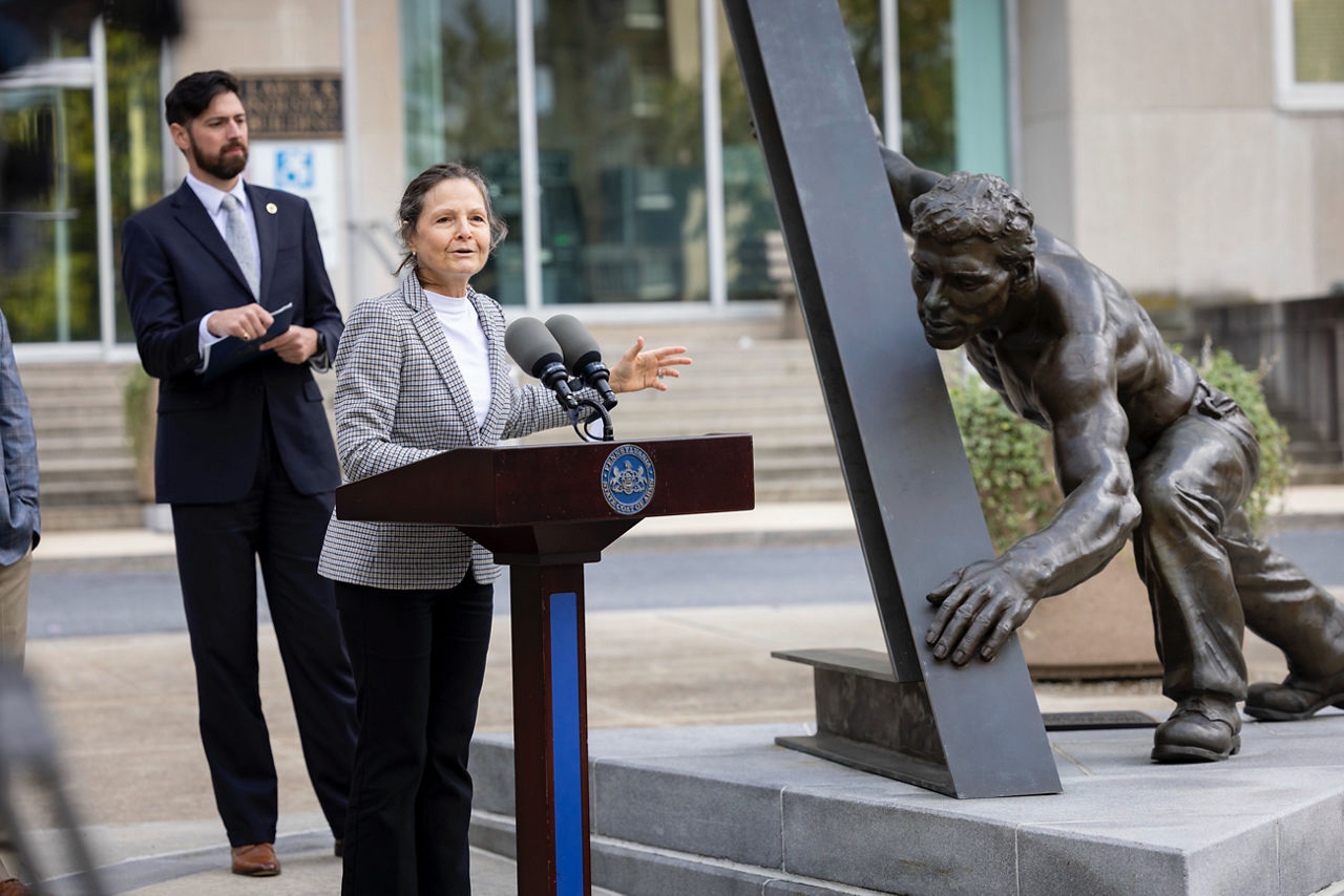PA Labor & Industry Secretary Nancy A. Walker speaks at event in front of Labor and Industry office building in Harrisburg, PA, rededicating bronze sculpture, titled 'The Pennsylvania Worker' by William F. Duffy.