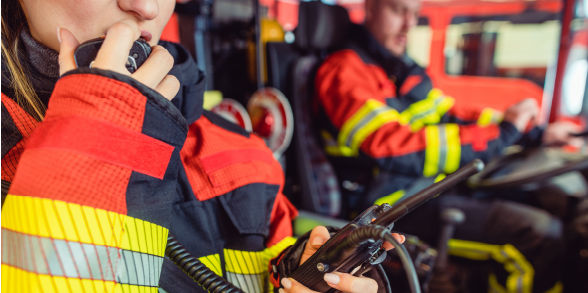 image of firefighter speaking on a radio