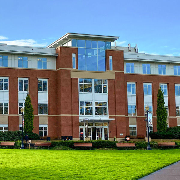Modern brick building with green lawn