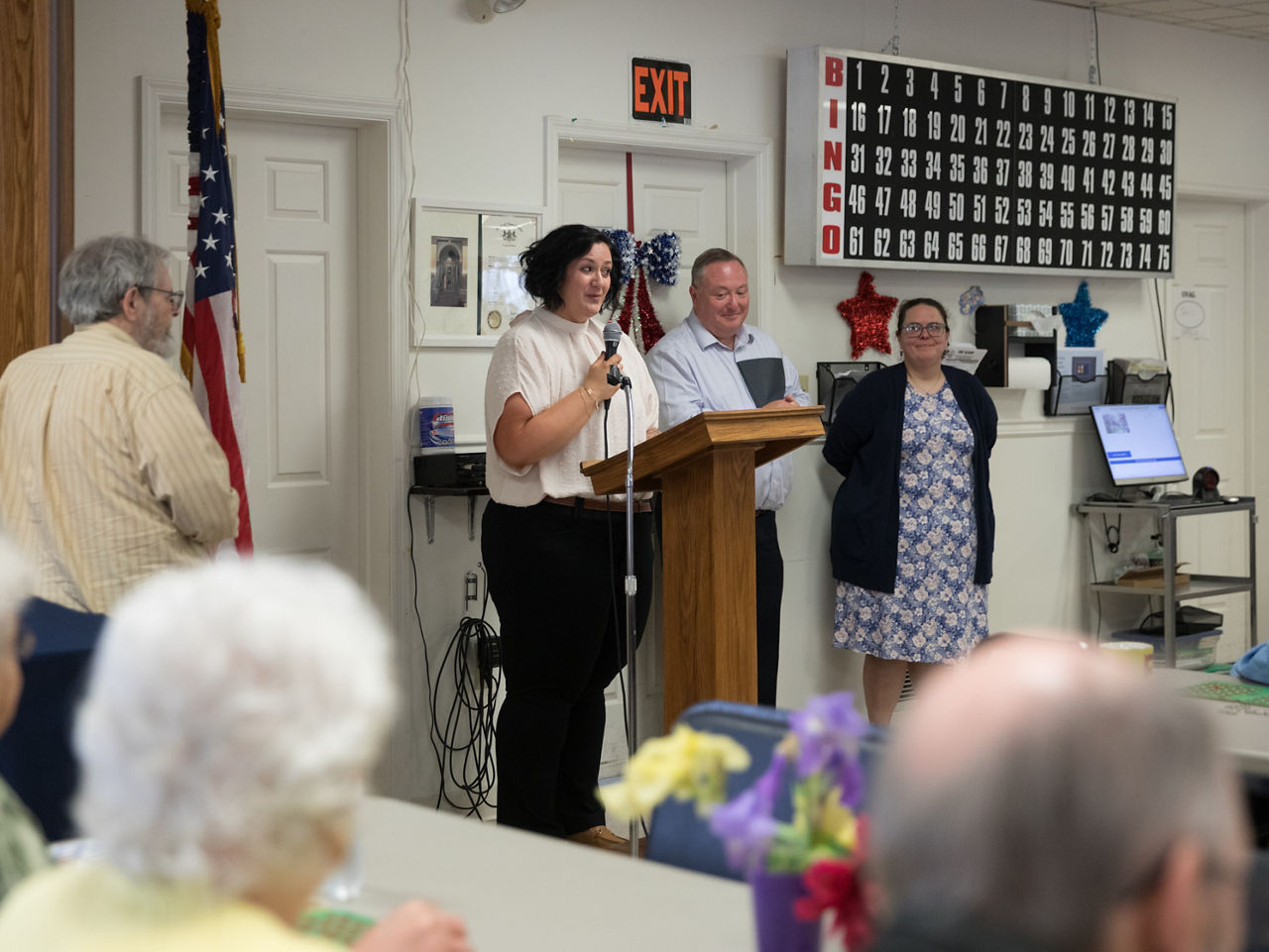 people standing by a podium