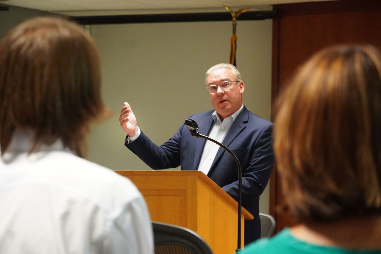 Secretary of the Commonwealth, Al Schmidt at a podium talking to a group of people