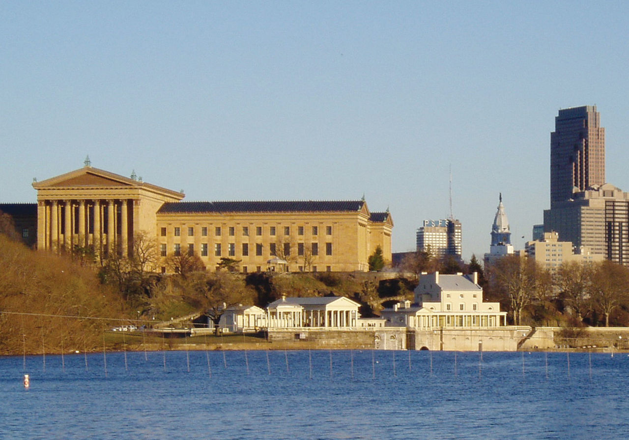Cityscape of the Philadelphia Art Museum with the Schuylkill River along the bottom of the photo