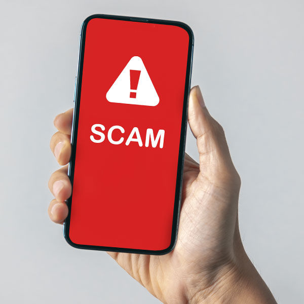 Image of phone that says Scam