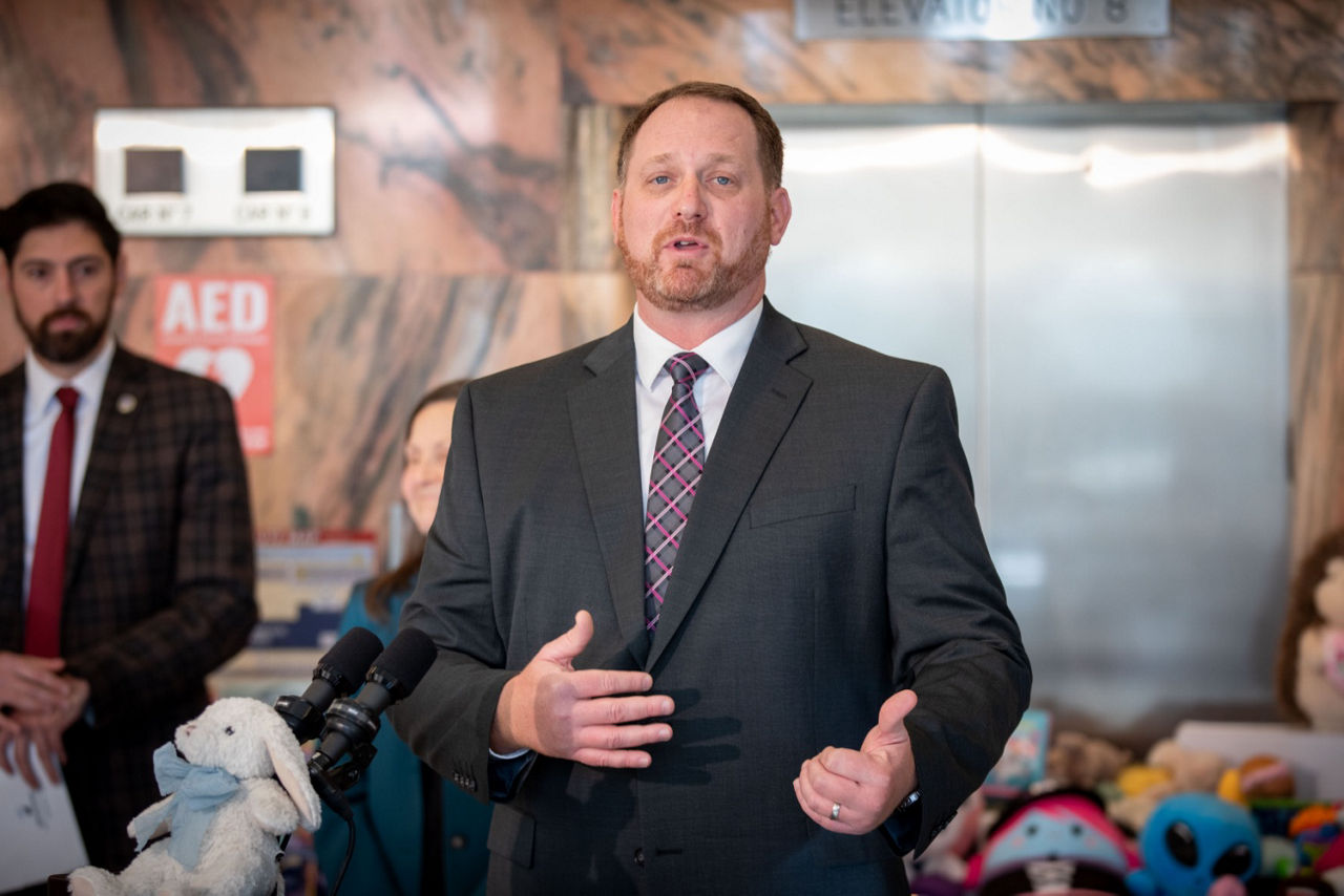 DHS Executive Deputy Secretary Andrew Barnes marks the start of the 2025 holiday season with the annual donation of stuffed toys