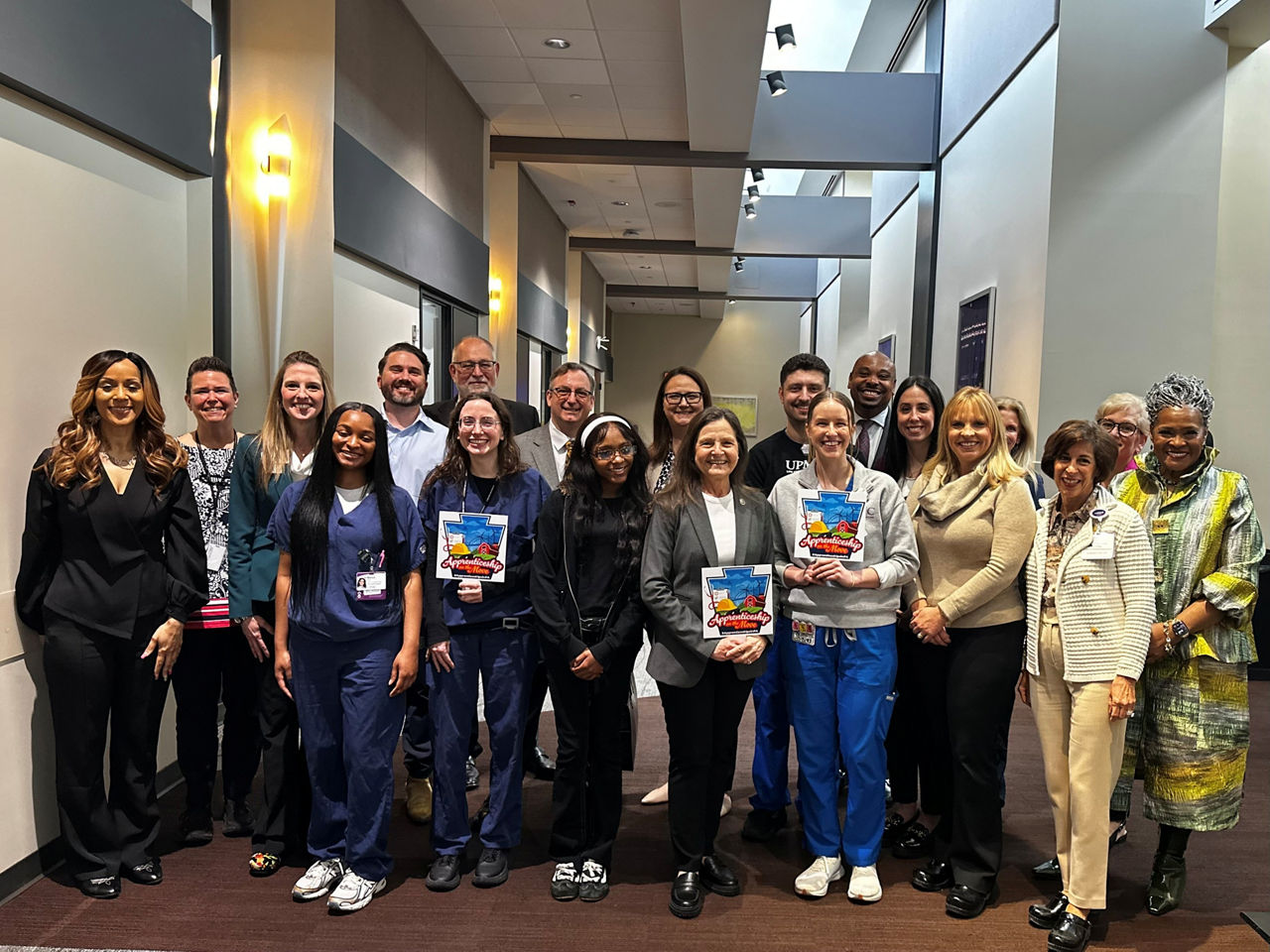 L and I Secretary Nancy A Walker stands with group of staff, educators and apprentices at UPMC 