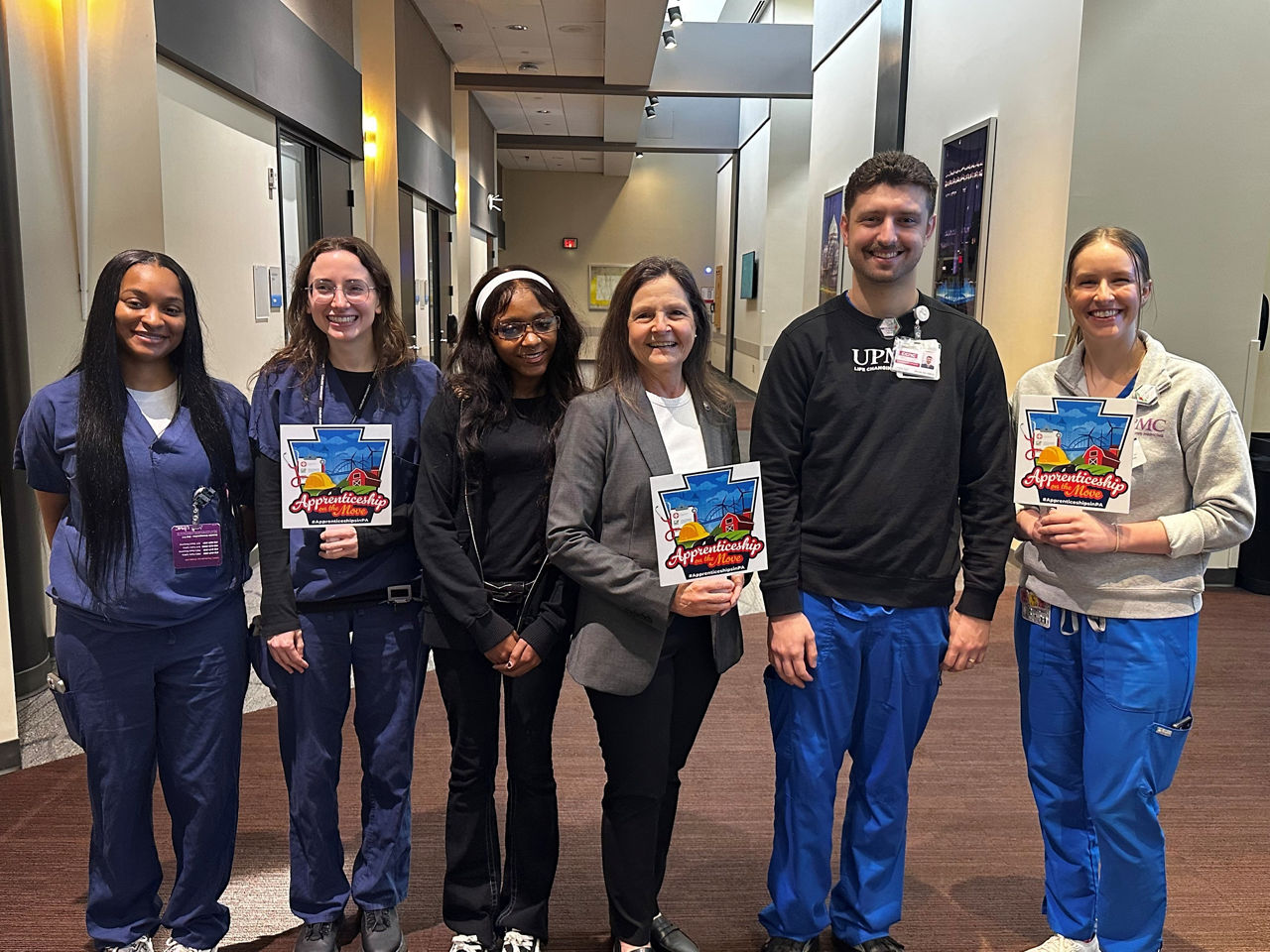L and I Secretary Nancy A Walker poses with staff and apprentices at UPMC