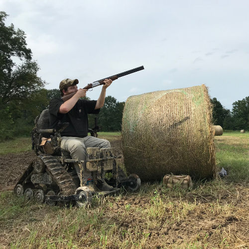 man in wheelchair hunting