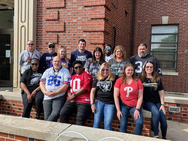 A group of Wernersville CCC employees wearing sports jerseys and shirts to celebrate employees week.