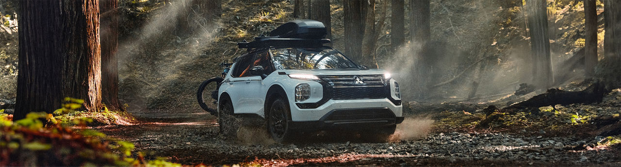 2025 Mitsubishi Outlander Trail Edition Driving on a trail