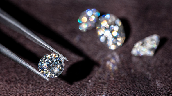 Round Cut Diamond in Tweezers