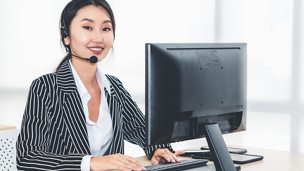 Woman on computer and microphone