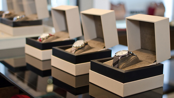 Luxury watches displayed in their cases in a jewelry store