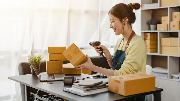 Woman scanning boxes