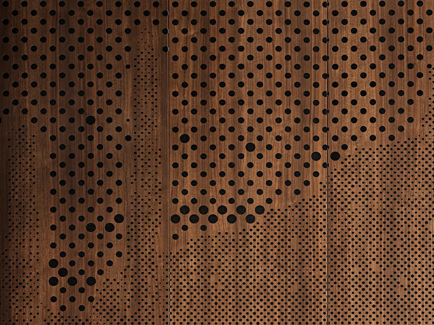 USG Ceilings Plus® Wallforms™ Metal Panel Wall System, Finish: Sarante® Forest Walnut, USG Ceilings Plus® Parti™ Custom Perforation, USG Ceilings Plus® Illusions® Metal Panel Ceiling System, Finish: Sarante® Forest Walnut, Architect: Adaptive Architects and DLR Group, Photo: © Jason Roehner