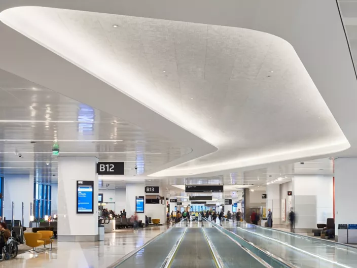 USG Ceilings Plus® Illusions® Metal Panel System, USG Ceilings Plus® Parti™ Custom Perforations, USG Ceilings Plus® Radians® Curved Metal Panel System, Finish: Blanco Mat® High LRV Paint, Architect: Woods Bagot/HKS, Photo: Fungi Media, © USG Interiors, LLC