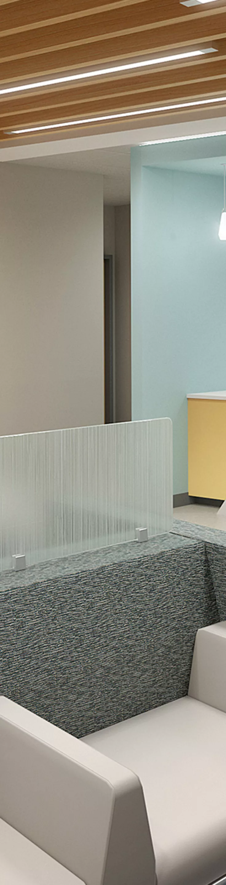The image shows a contemporary waiting room in a healthcare facility, featuring a sleek reception desk and comfortable seating. The space is well-lit with overhead lights and has wood accents on the ceiling.