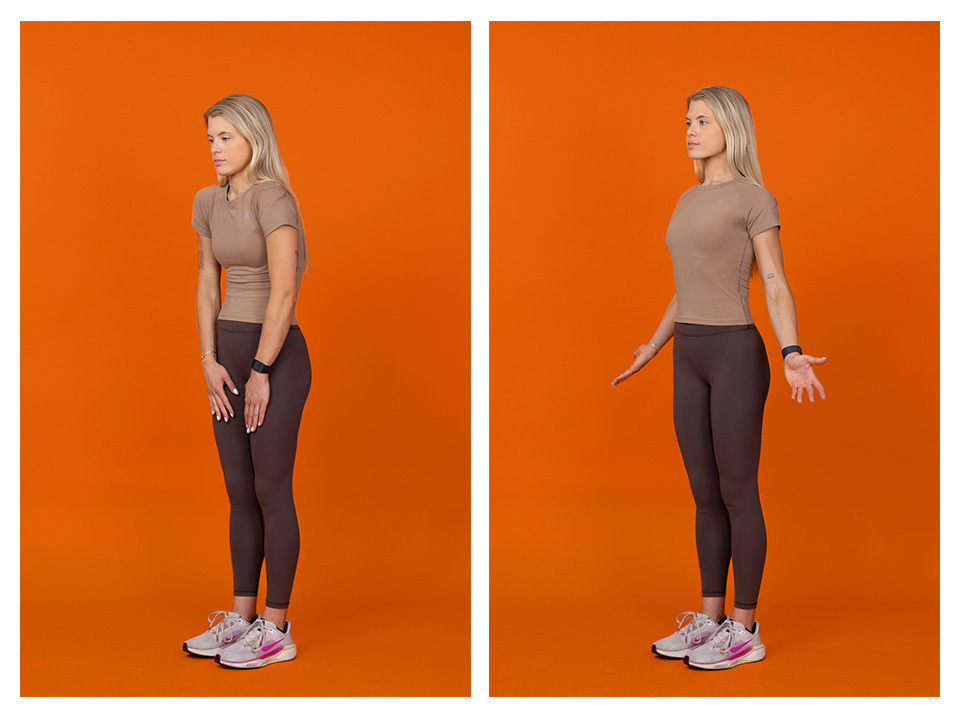 A woman is shown in two side-by-side images performing a standing posture exercise. She is dressed in a fitted t-shirt, dark leggings, and athletic sneakers, standing against a solid orange backdrop. The first image shows her with arms at her sides, while the second shows her with arms slightly extended outward. The setting is studio-lit, emphasizing the exercise movement and casual athletic style.
