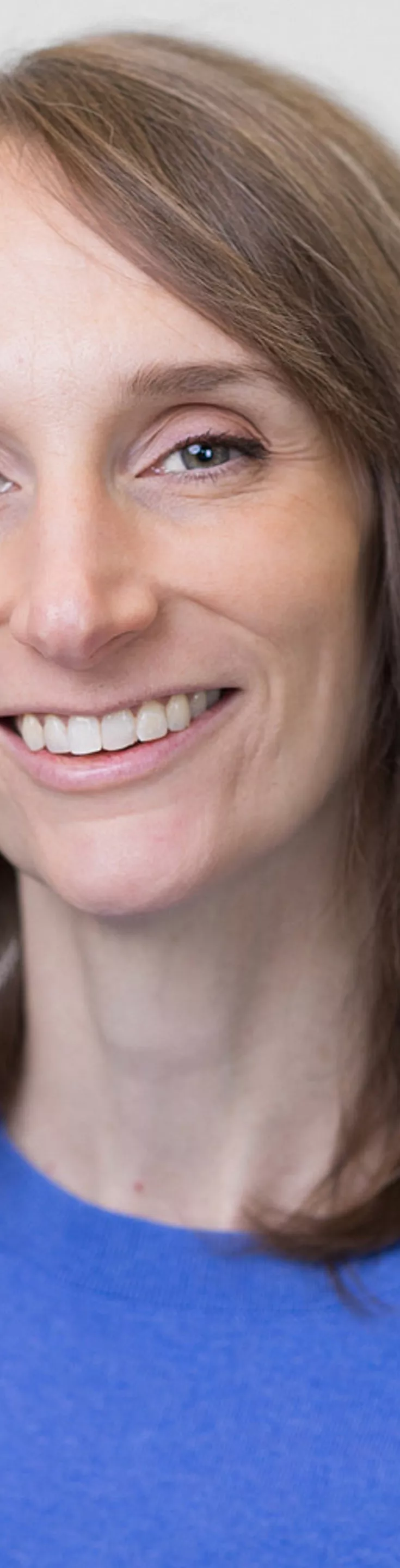 Headshot of Amelia Frank. She is wearing a blue sweater.