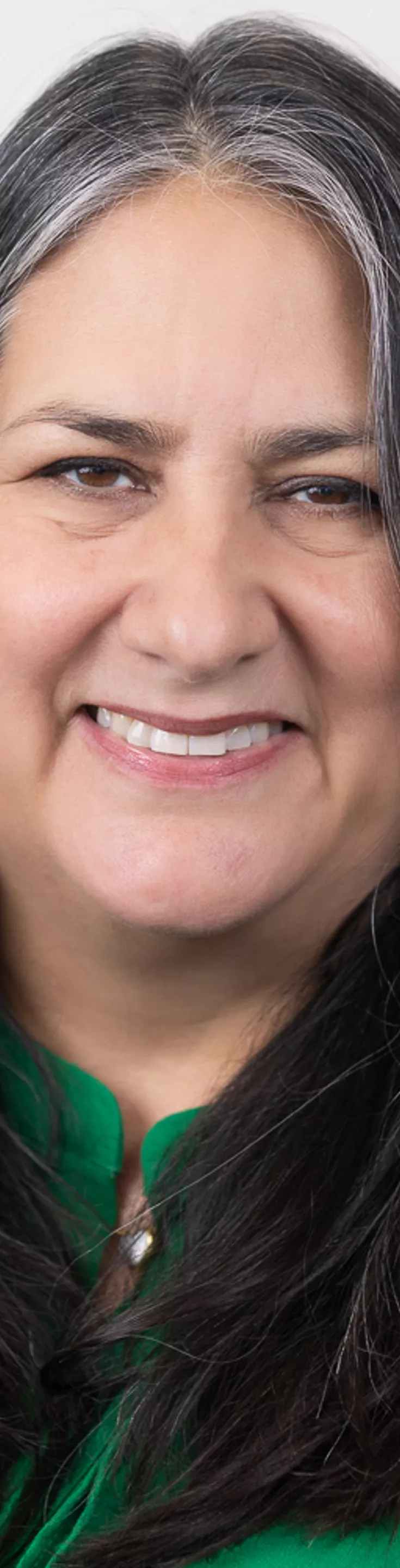 Headshot of Barbara Chenoweth. She is wearing a green blouse.