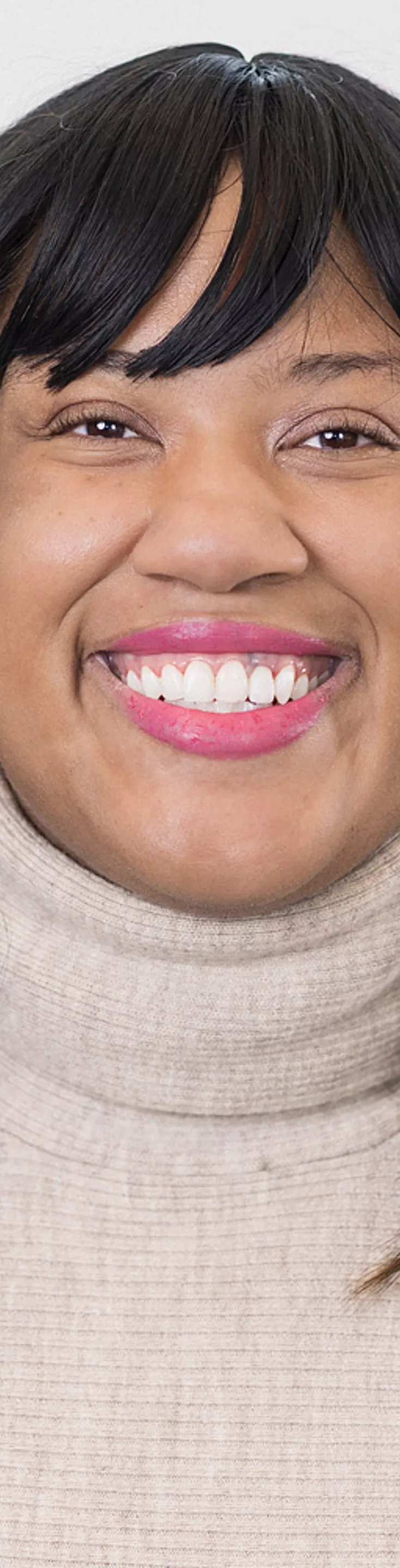 Heasdhot of Chrisitna Alexander. She is wearing a beige turtleneck sweater.