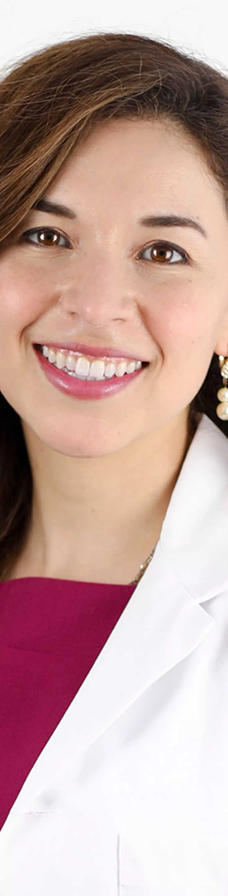 Headshot of Christina Salazar.  She is wearing a white coat and a pink blouse.