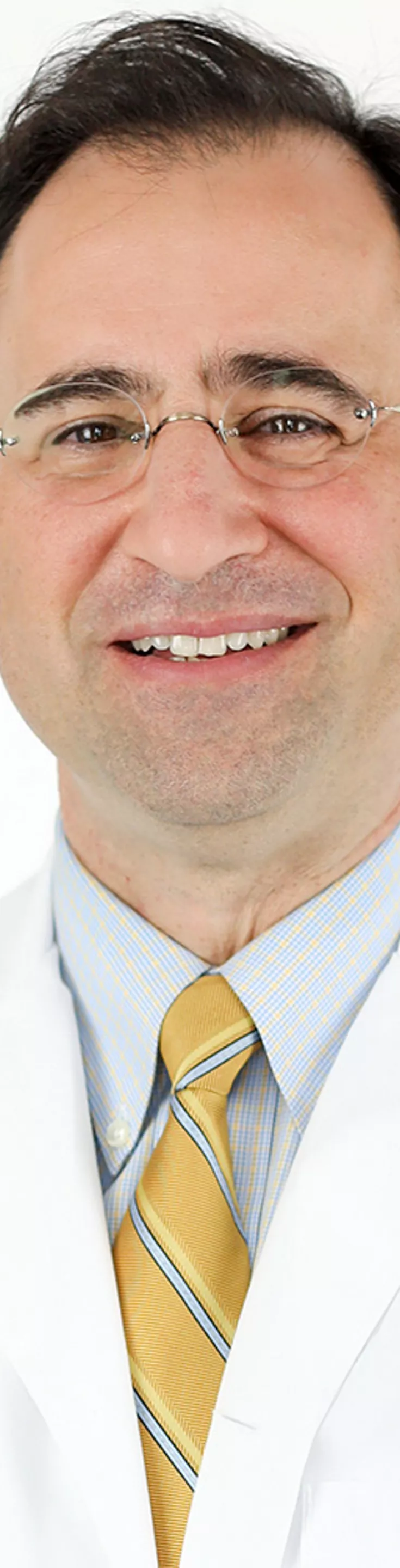 Headshot of David Paydarfar.  He is wearing a white coat and a light blue dress shirt.