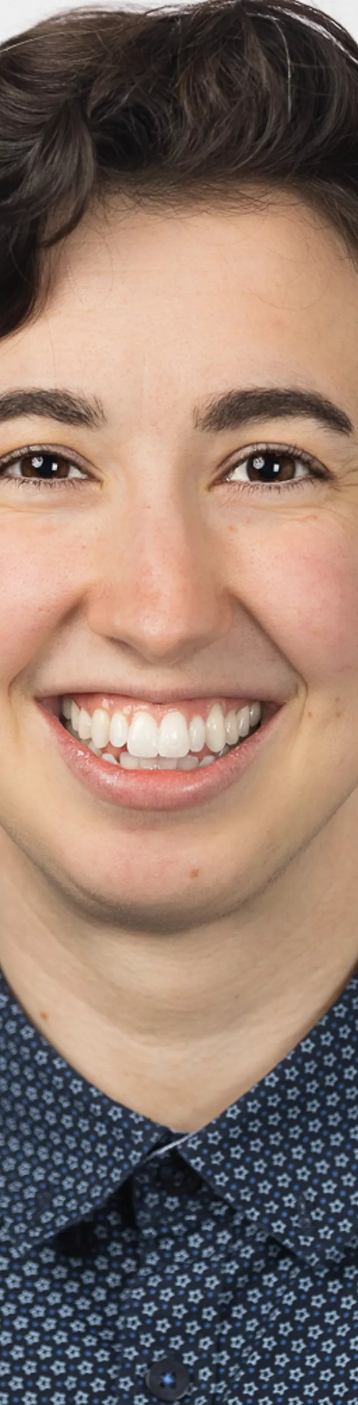 Headshot of Jess Goldstein-Kral. She is wearing a navy blouse.