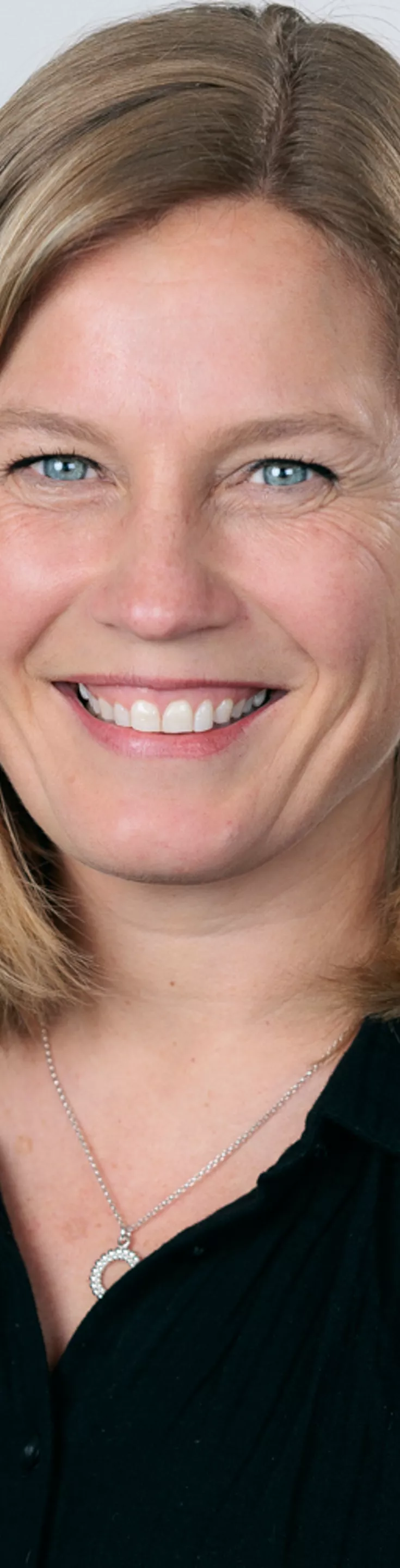Headshot of Maj Henriksson. She is wearing a black blouse.