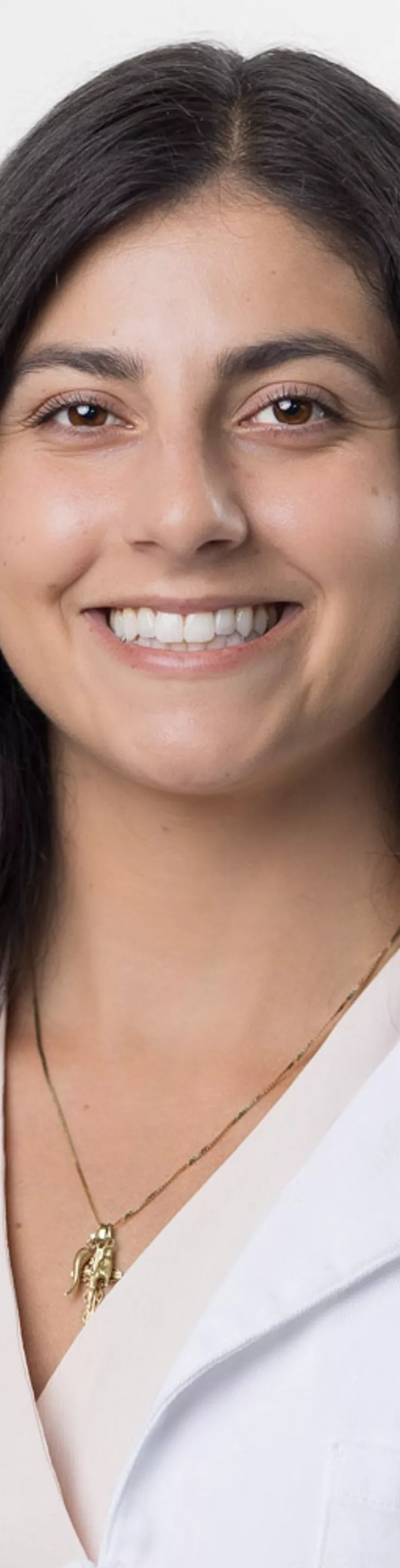 Headshot of Sofia Silvestri. She is wearing a beige blouse and a white coat.