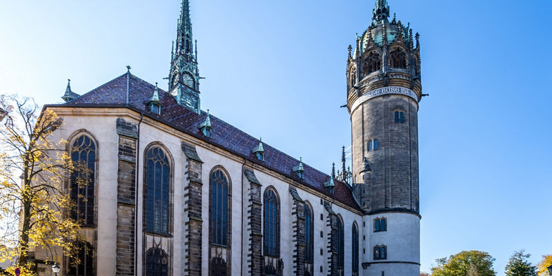Historic church with tall spires in sunlight