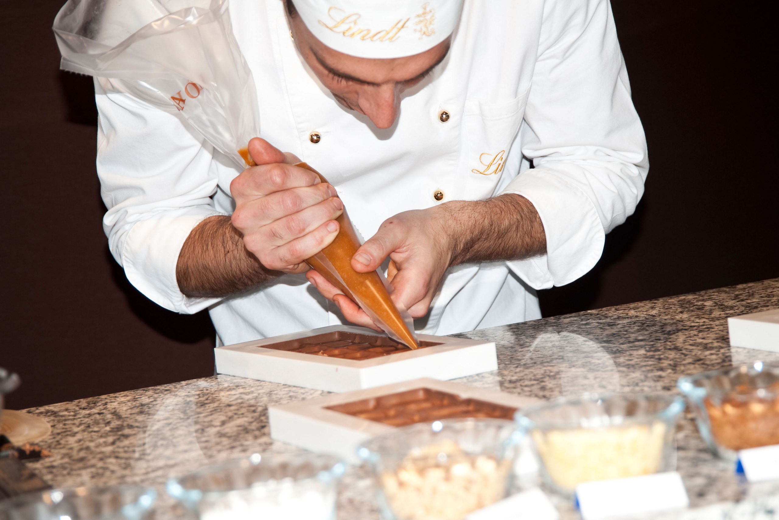 Chef Pouring Lindt Chocolates Paris