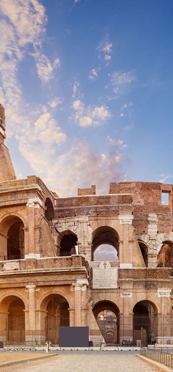 Colosseum at sunrise with vibrant sky