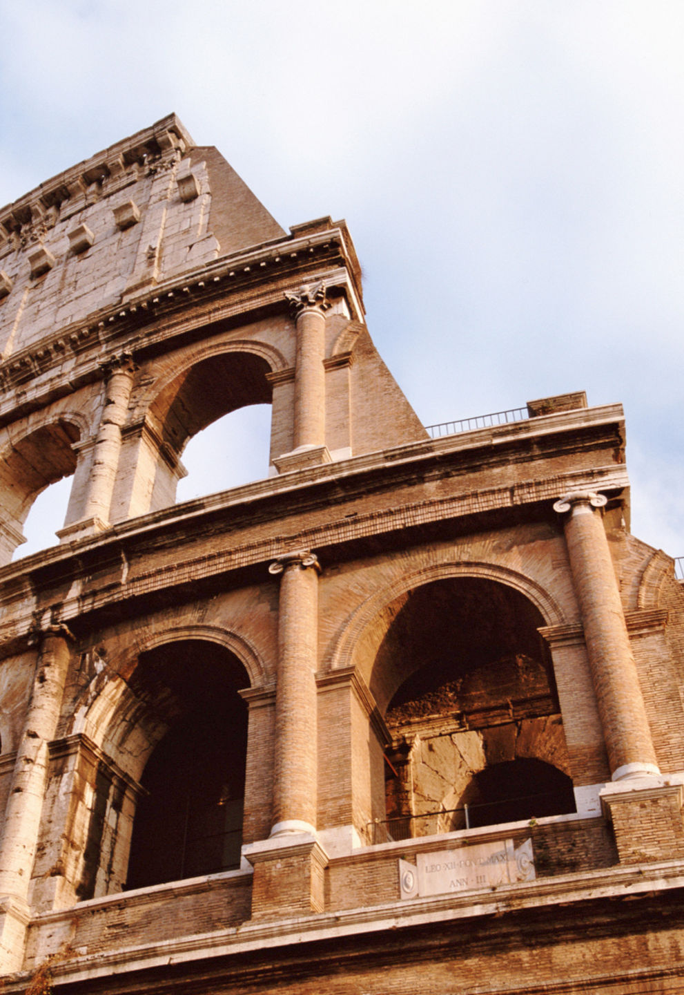 Historic Colosseum under a cloudy sky