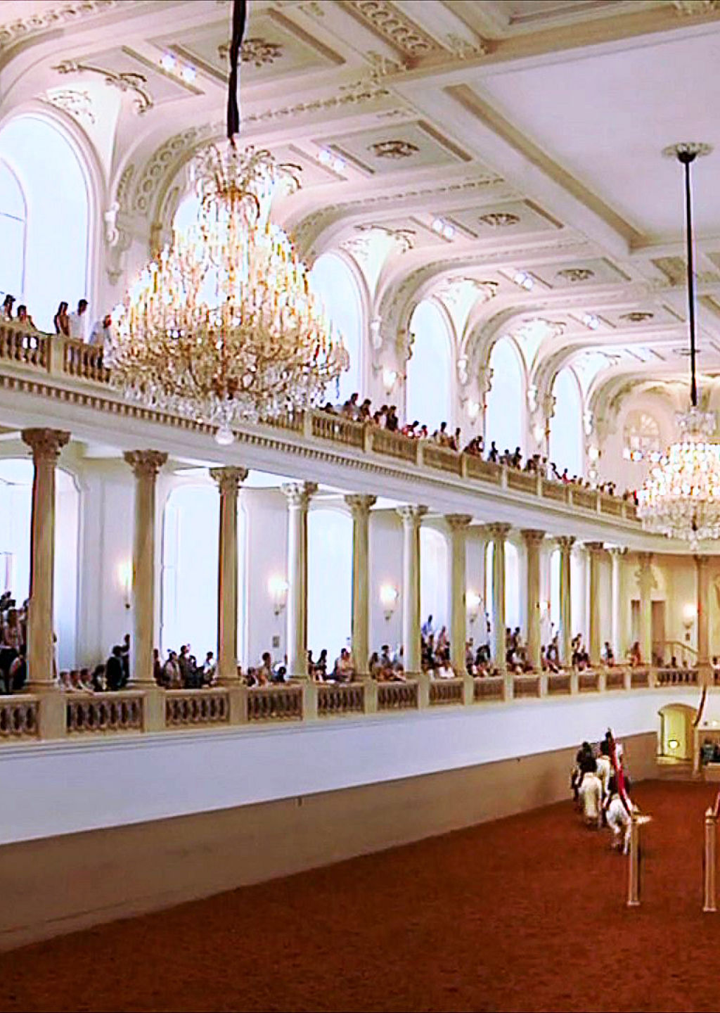 Equestrian performance in grand indoor arena