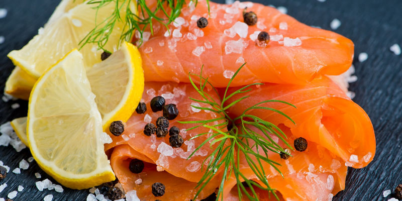 Smoked salmon with lemon and dill garnish