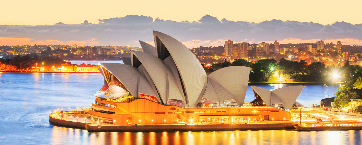 Sydney Opera House at sunset with cityscape