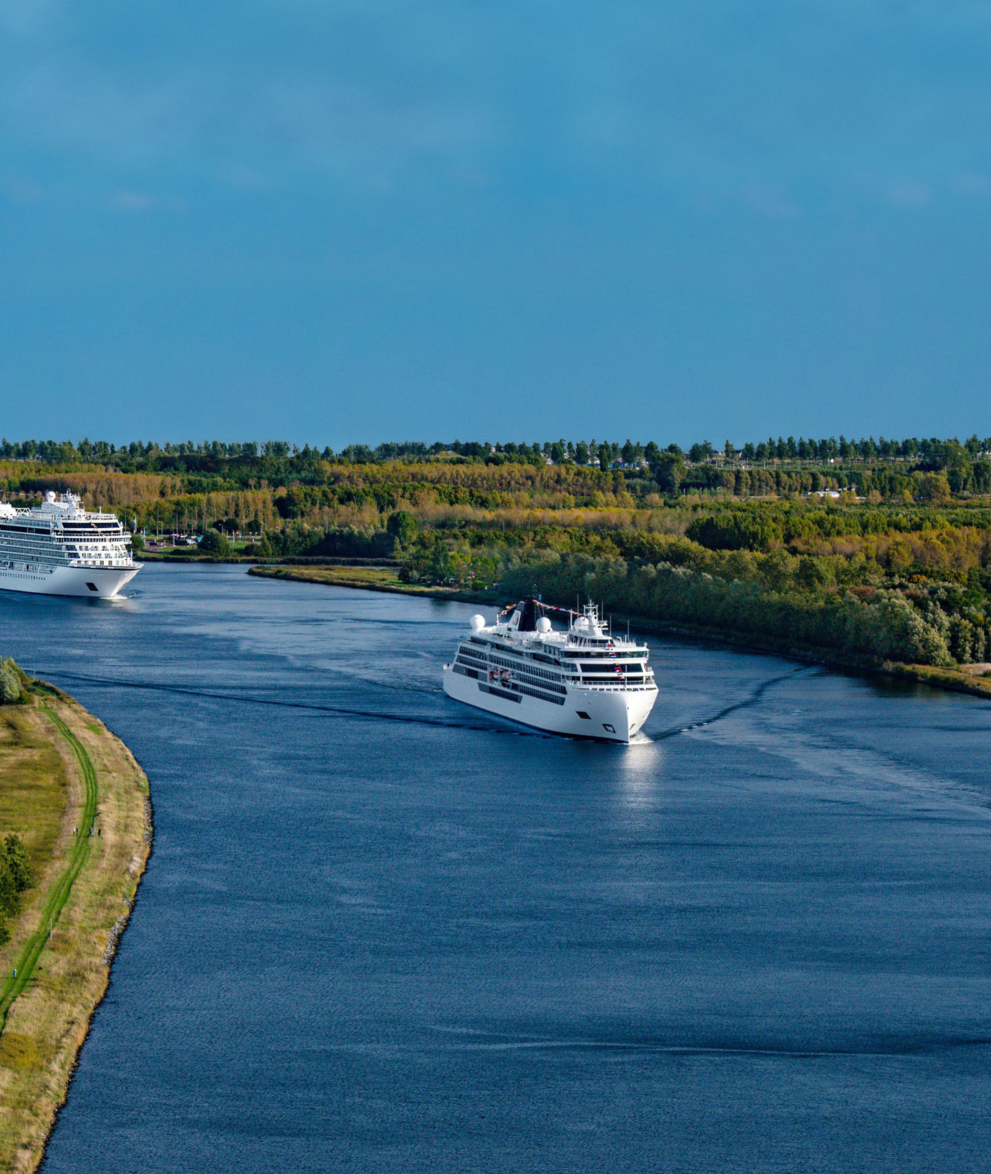 Cruise ships sailing on scenic river