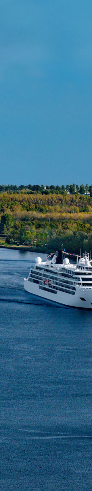 Cruise ships sailing on scenic river