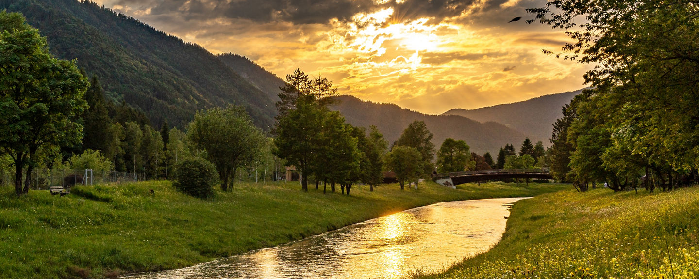 Serene river landscape at sunset