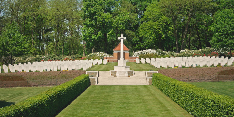 Serene military cemetery with central cross